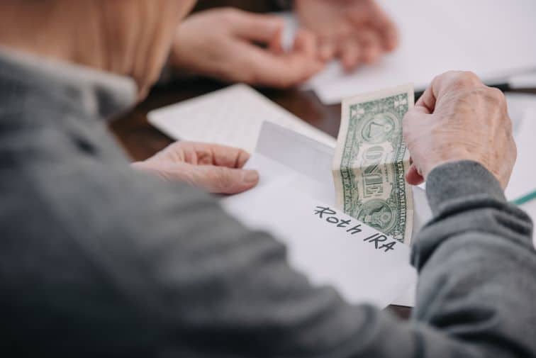 Man Saving his after-tax dollars in envelope for his Roth contributions